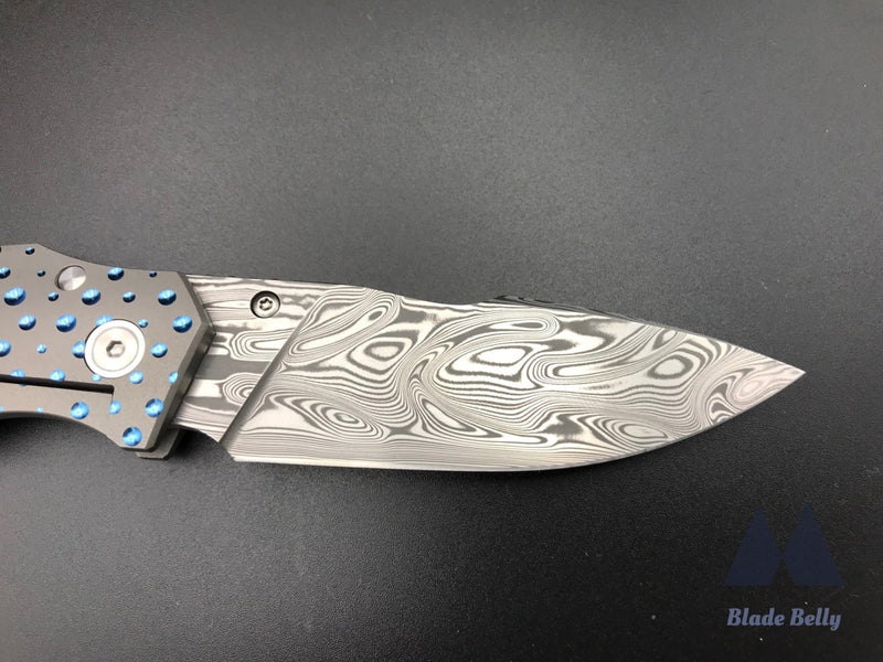 Jason Guthrie Scout - Damasteel Harpoon Drop Point W/ Blue Raindrop Milled Handles (Blade 2019)