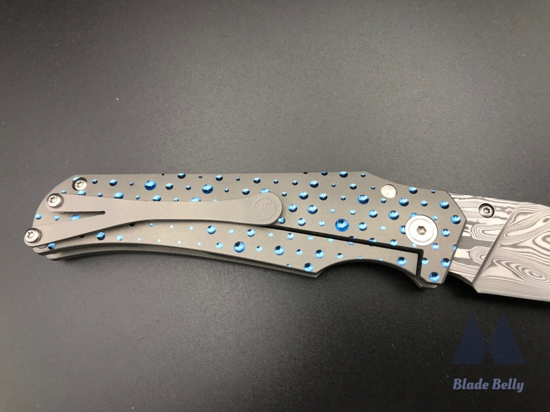 Jason Guthrie Scout - Damasteel Harpoon Drop Point W/ Blue Raindrop Milled Handles (Blade 2019)