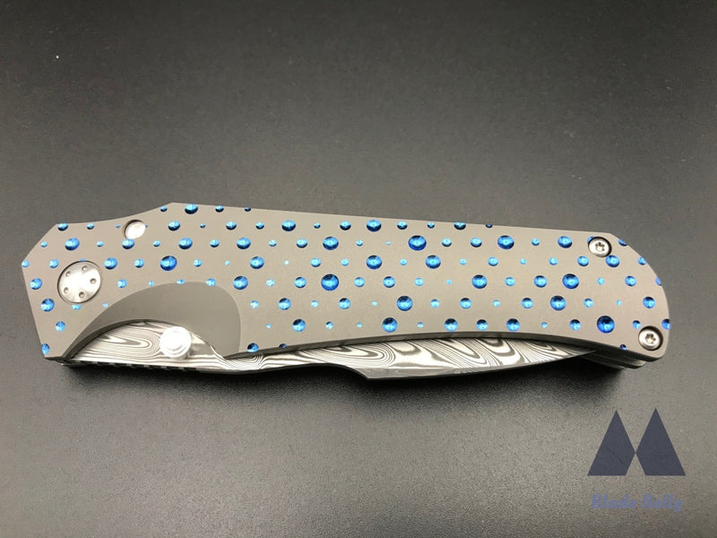 Jason Guthrie Scout - Damasteel Harpoon Drop Point W/ Blue Raindrop Milled Handles (Blade 2019)