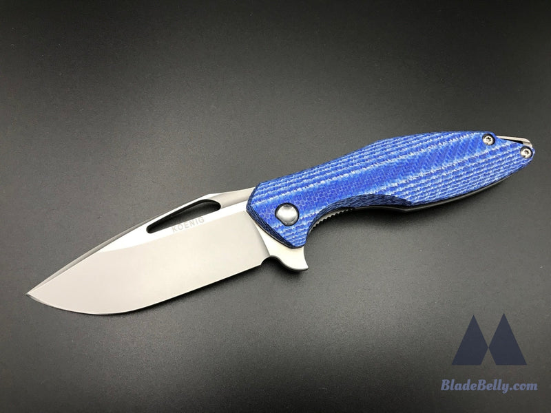 Koenig Arius - Burnished Blade Satin Flats Drop Point Blue Twill Carbon Fiber And Polished Hardware