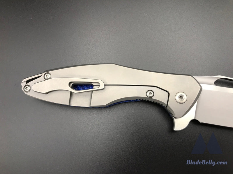 Koenig Arius - Burnished Blade Satin Flats Drop Point Blue Twill Carbon Fiber And Polished Hardware