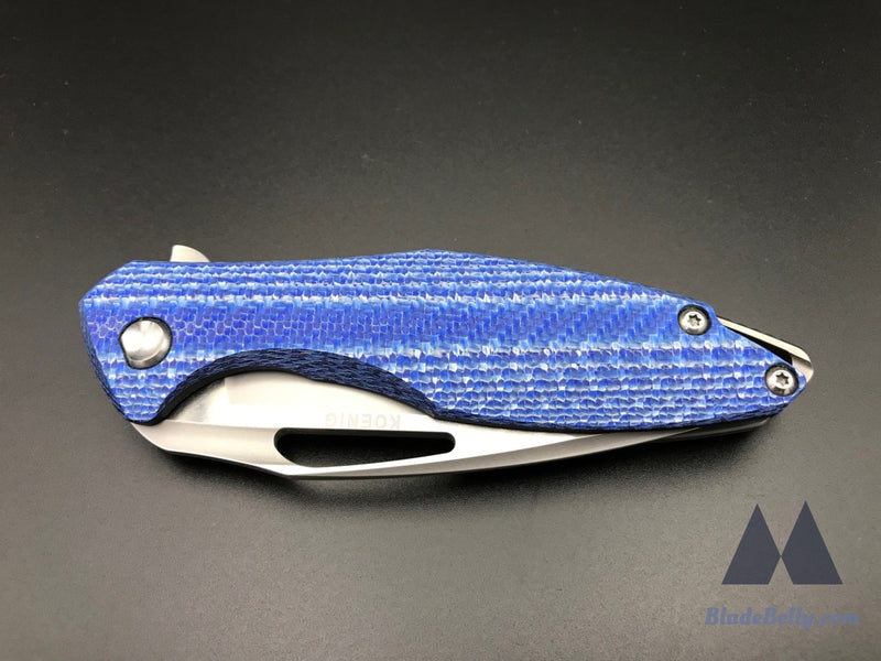 Koenig Arius - Burnished Blade Satin Flats Drop Point Blue Twill Carbon Fiber And Polished Hardware