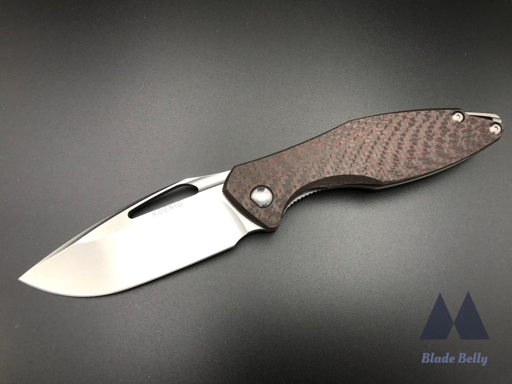 Koenig Arius - Flipper Delete Burnished Drop Point And Red Twill Carbon Fiber